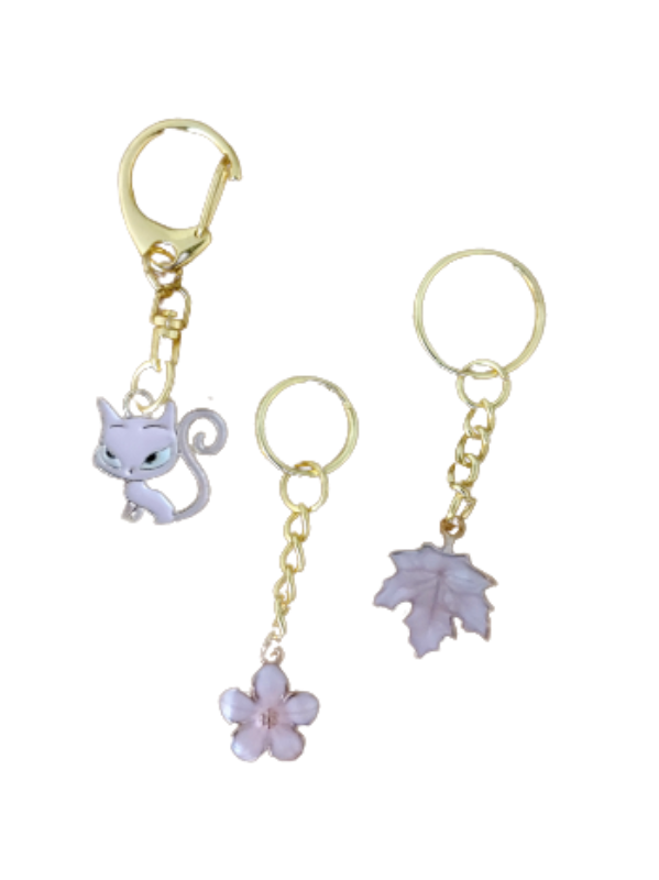 Gold keychains with light pink pendants (set of 3)