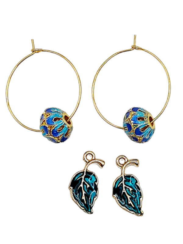 Close up - blue and gold metal beads and green leaves